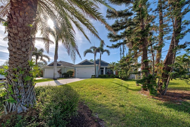 view of front of property with a garage and a front yard