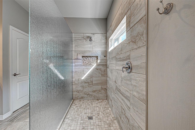 bathroom featuring tiled shower