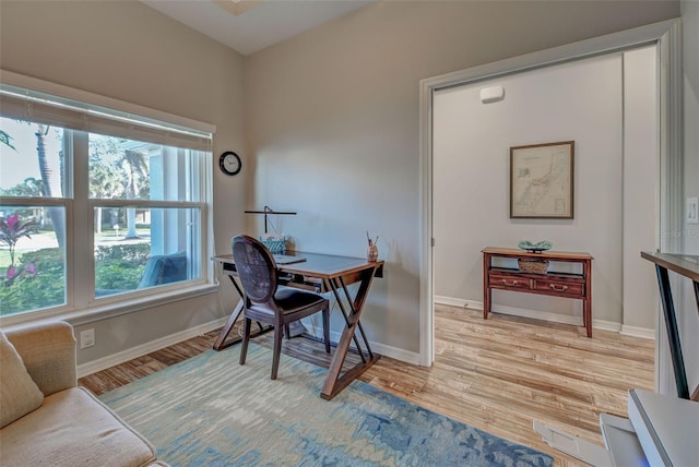 office with light hardwood / wood-style flooring