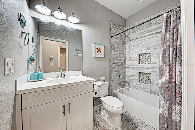 full bathroom with shower / tub combo with curtain, vanity, and toilet