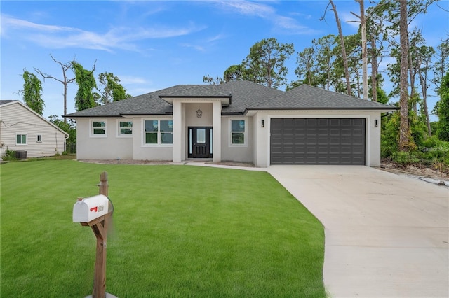 prairie-style house with a front yard, a garage, and central AC