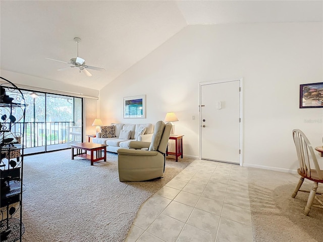 living room with light tile patterned floors, high vaulted ceiling, a ceiling fan, and baseboards