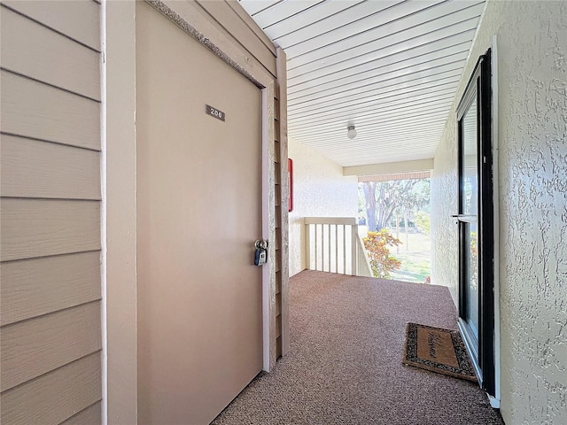 view of exterior entry with stucco siding