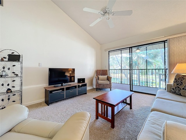 carpeted living room with ceiling fan, high vaulted ceiling, and baseboards