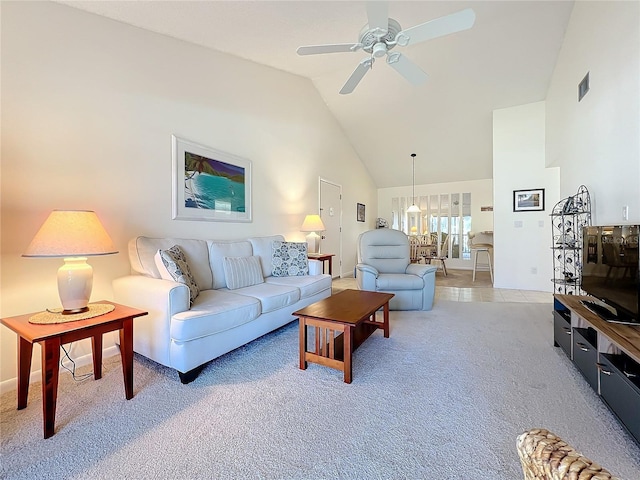 carpeted living area featuring high vaulted ceiling, visible vents, and a ceiling fan