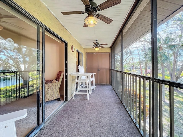 unfurnished sunroom with a water view