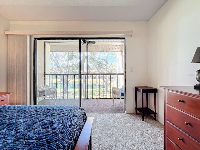 bedroom with light carpet and access to outside