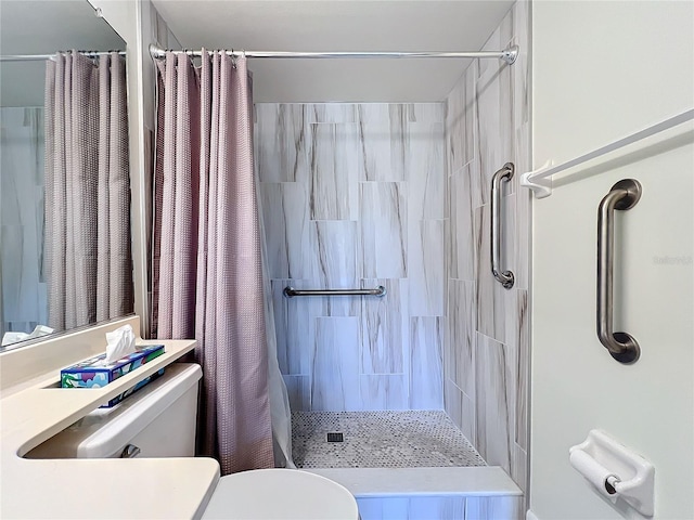 full bath with toilet and a shower stall