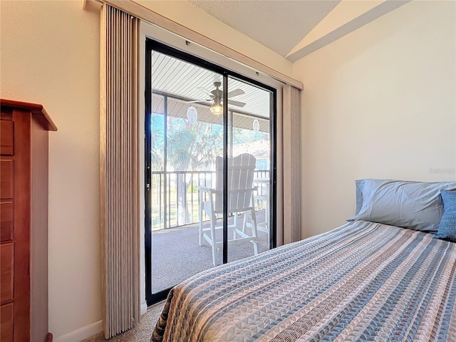 carpeted bedroom with lofted ceiling, baseboards, and access to exterior