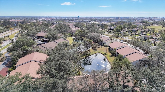 birds eye view of property featuring a water view and a residential view