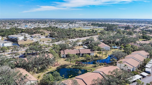 bird's eye view featuring a water view and a residential view