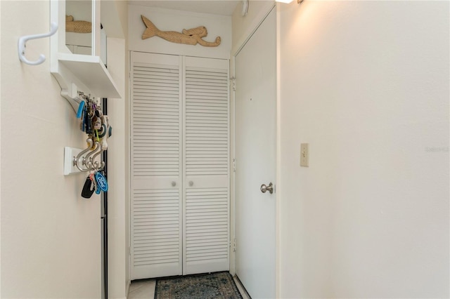 corridor featuring tile patterned flooring