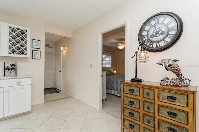 hall with light tile patterned floors