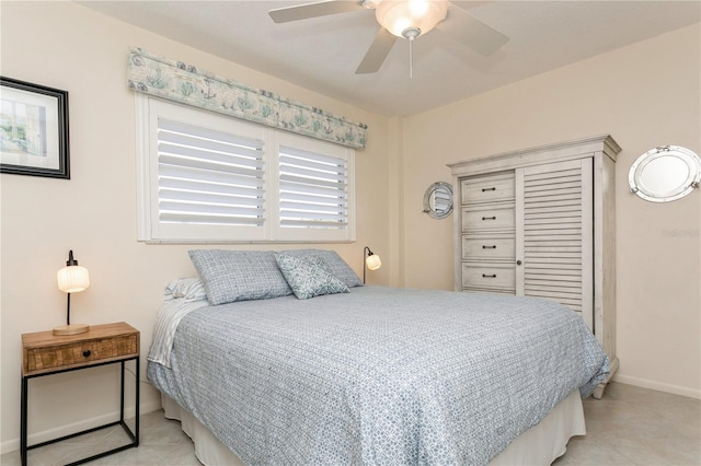 tiled bedroom with ceiling fan