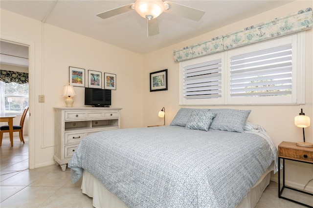 bedroom featuring ceiling fan and light tile patterned flooring