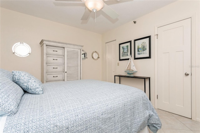 tiled bedroom with ceiling fan