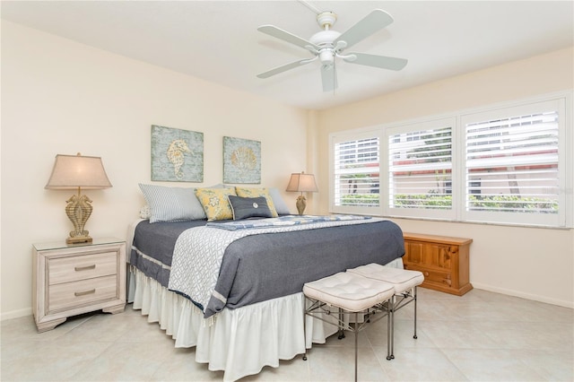 tiled bedroom with ceiling fan