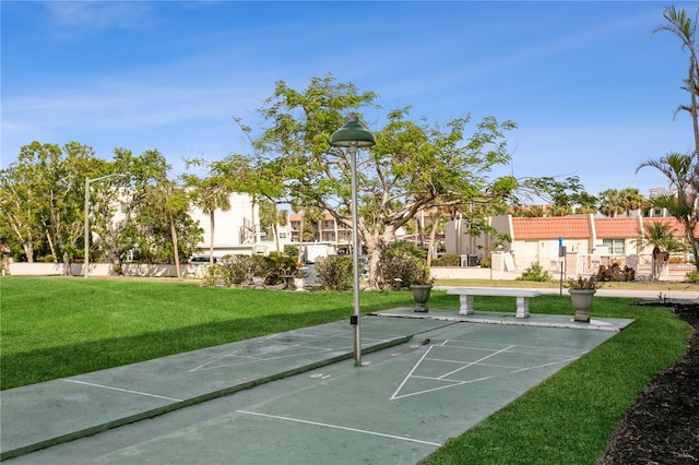 view of home's community with a lawn