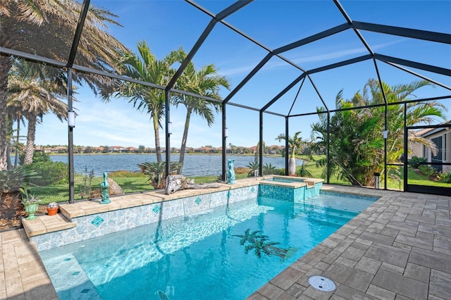 view of swimming pool featuring a patio, a lanai, an in ground hot tub, and a water view