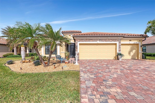 mediterranean / spanish-style home with a garage and a front lawn