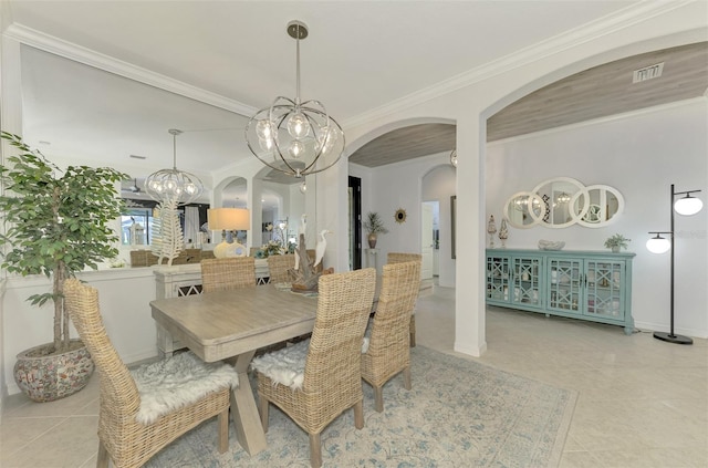 dining area featuring crown molding and light tile patterned flooring