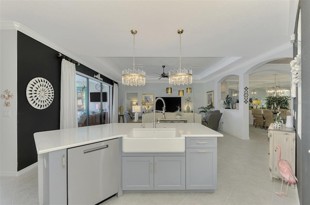 kitchen featuring sink, stainless steel dishwasher, ceiling fan, and a center island with sink