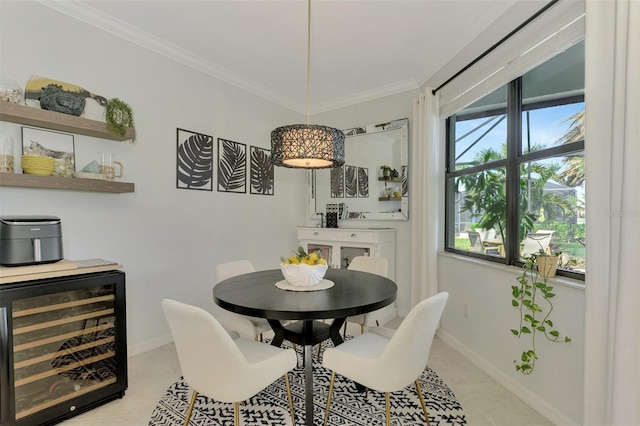 dining space featuring crown molding, light tile patterned floors, and wine cooler