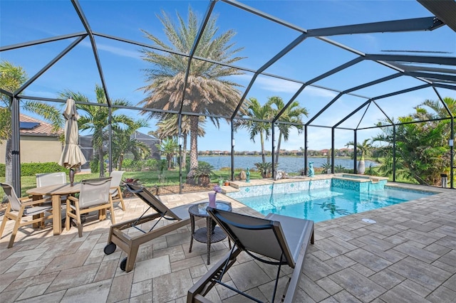 view of swimming pool featuring an in ground hot tub, a water view, glass enclosure, and a patio