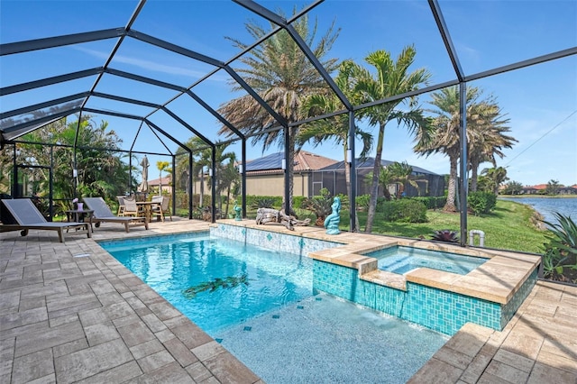 view of pool with a lanai, a patio, a water view, pool water feature, and an in ground hot tub