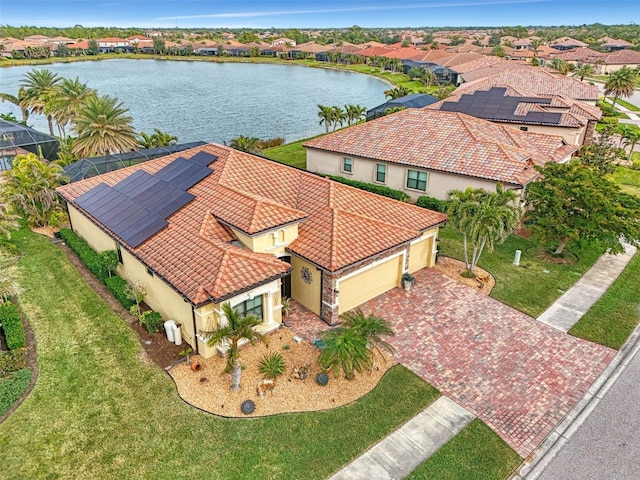 birds eye view of property featuring a water view and a residential view