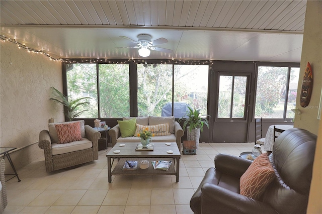 sunroom featuring ceiling fan