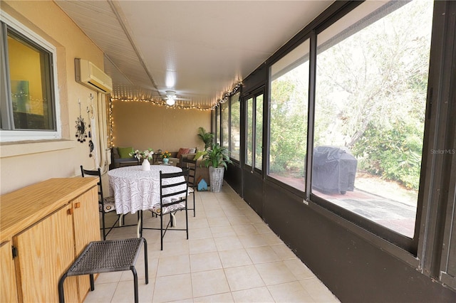 sunroom with a wall mounted AC and a healthy amount of sunlight