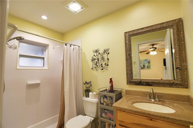 bathroom featuring toilet, vanity, ceiling fan, and curtained shower