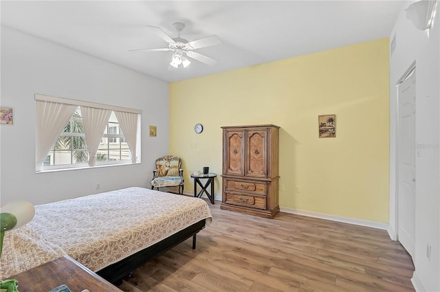 bedroom featuring ceiling fan and light hardwood / wood-style flooring