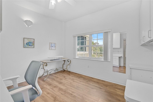 office with ceiling fan and light hardwood / wood-style flooring