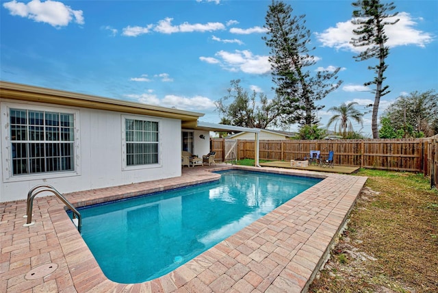 view of swimming pool featuring a patio area