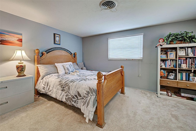 bedroom with light carpet