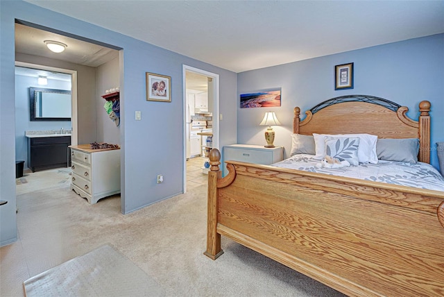 bedroom featuring light colored carpet and connected bathroom