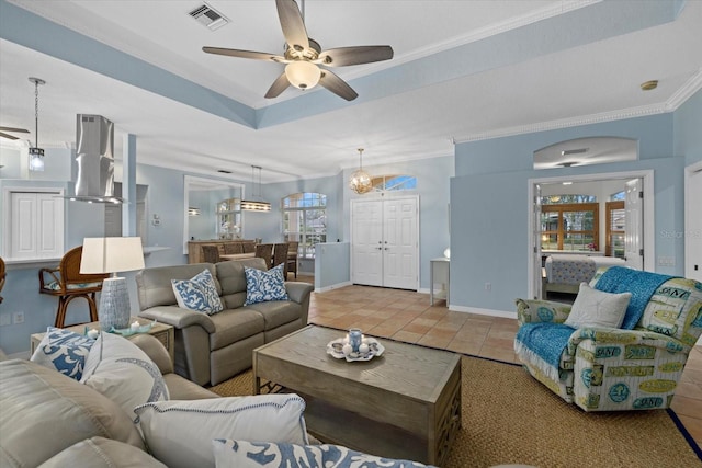 tiled living room featuring ornamental molding and ceiling fan