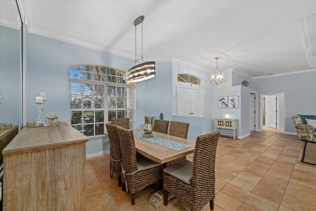 dining room featuring light tile patterned floors, a notable chandelier, and crown molding