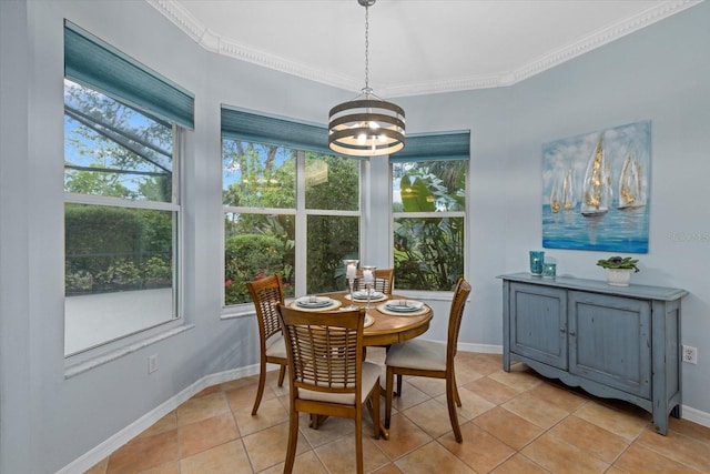 tiled dining area featuring an inviting chandelier and crown molding