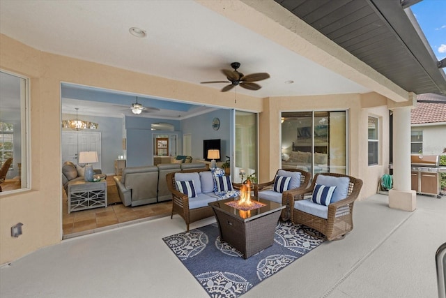 view of patio / terrace featuring an outdoor living space with a fire pit