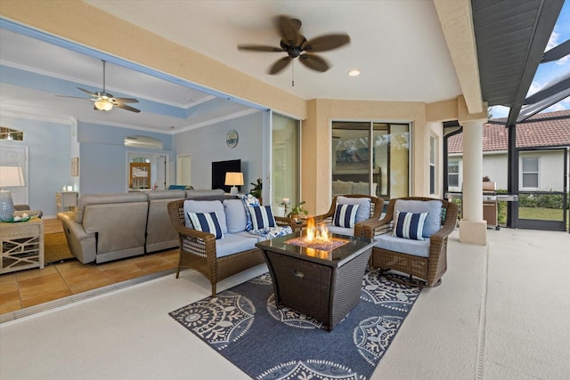 view of patio with an outdoor living space with a fire pit