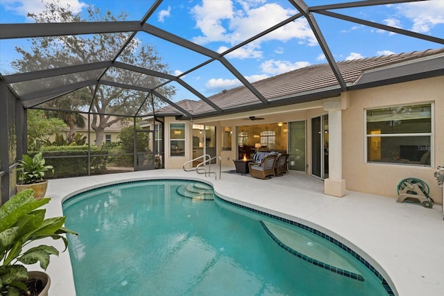 view of swimming pool featuring a lanai, an outdoor living space, and a patio