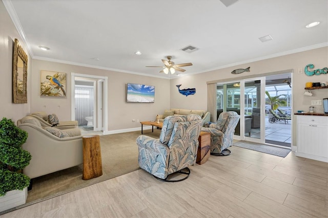 living room featuring ceiling fan and crown molding