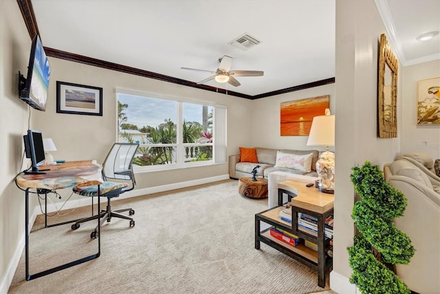 carpeted office space featuring ceiling fan and crown molding