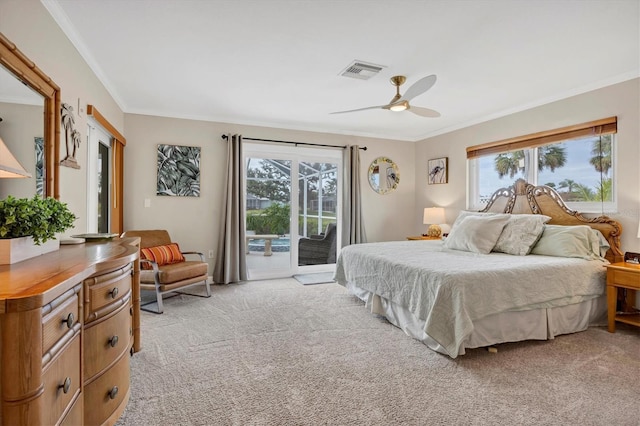 carpeted bedroom featuring ceiling fan, access to exterior, multiple windows, and ornamental molding