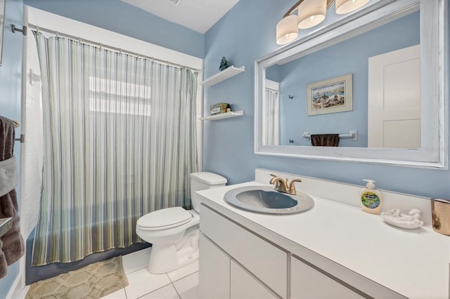 full bathroom featuring toilet, vanity, tile patterned floors, and shower / tub combo with curtain