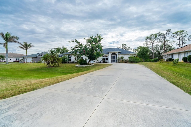 ranch-style house featuring a front lawn