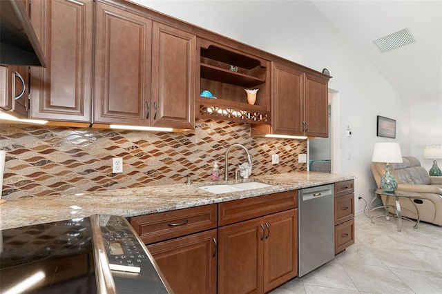 kitchen with lofted ceiling, stainless steel dishwasher, sink, light stone countertops, and light tile patterned floors